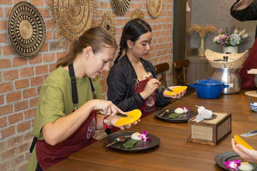 Bangkok: Cooking Class with Market Visit & Tuk Tuk Ride - Cooking four dishes at Sabieng Thai Cooking School