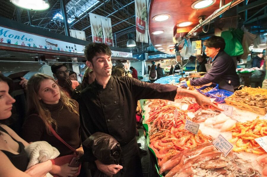 Barcelona: Paella Cooking Experience & Boqueria Market Tour - Building the seafood paella together