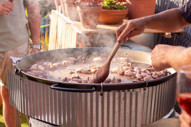 Barcelona Rooftop Paella Cooking Class with Sangria & Local Host - The rooftop question and weather risk
