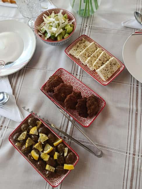 Berat: Discover Albania with Cooking Class w/ Drink Tastings - Sitting down to eat your own Albanian meal