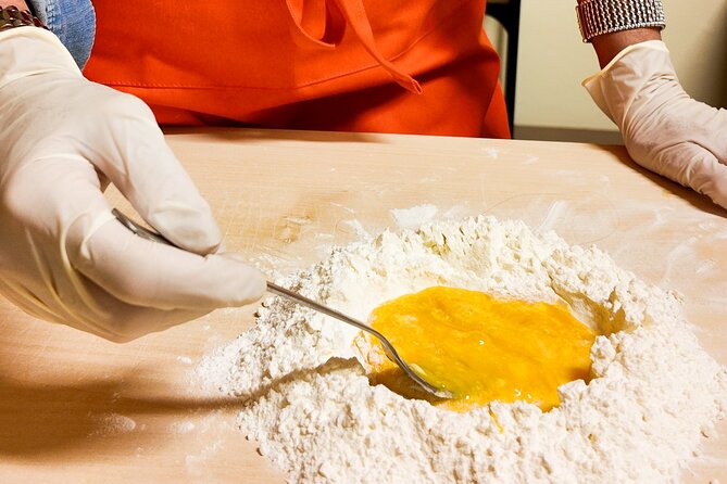 Bologna Local Pasta Cooking Class, Ragu, Spritz, Wine & Gelato - Making a Casoni spritz with local character