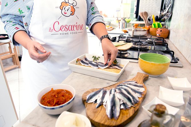 Cesarine: Home Cooking Class & Meal with a Local in Varenna - Sitting down with wine and the finished meal