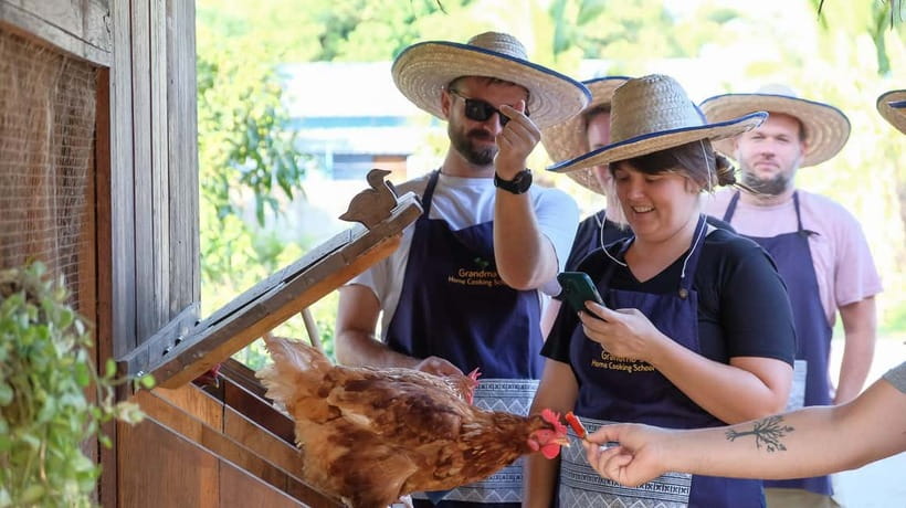 Chiang Mai: Authentic Cooking Class with Market & Farm Visit - Cooking and eating in the open-air kitchen