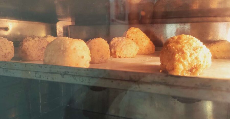 Cooking Class Arancini in Catania - Cooking the rice for the arancino