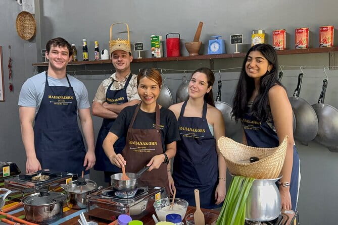Customizable Thai Cooking Class with Onnuch Market in Bangkok - Eating five dishes in a cool classroom