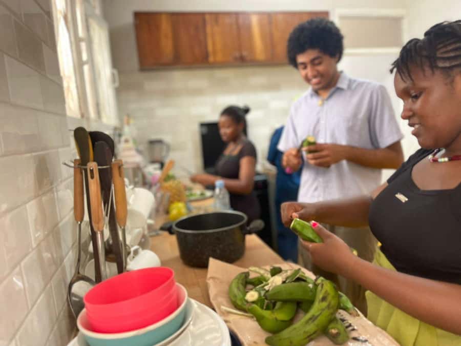 Dar es Salaam: Taste of Tanzania Cooking Class and Food Tour - Using a mbuzi, kinu, and traditional cooking pots