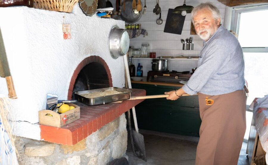 Dining In Rethymno: An Evening Of Cretan Cooking - Homemade raki, wine, and a long table