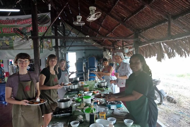 Farm-To-Table Healthy Cooking Class in Ho Chi Minh City - Four dishes in an open-air kitchen