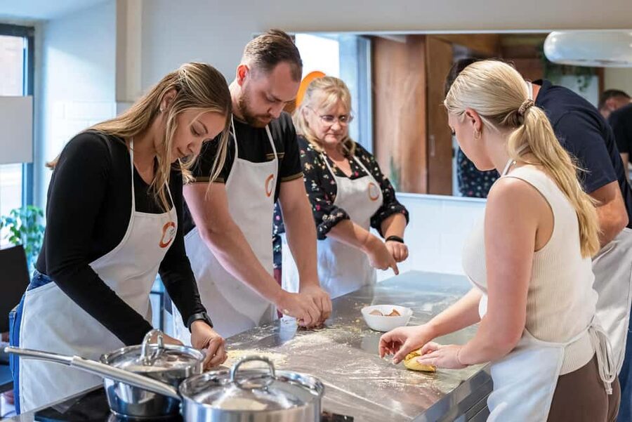 Florence: Handmade Pasta & Dessert Class with Unlimited Wine - Sitting down to eat your own work