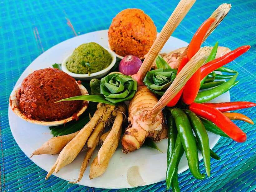 Full Day Thai Cooking Class in Organic Farm and Market - Eating your own cooking in the kitchen garden