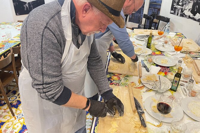 Hands-On Pasta Making and Traditional Tiramisu Workshop - Rolling egg pasta with only hands and a pin