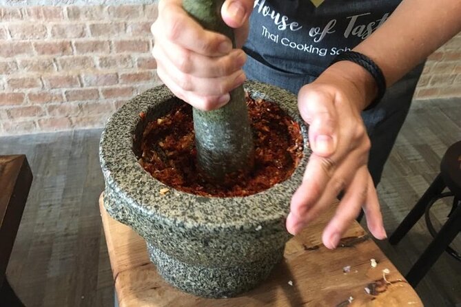 Hands-on Thai Cooking Class & Market Tour in Sukhumvit - Making curry paste, coconut milk, and four dishes
