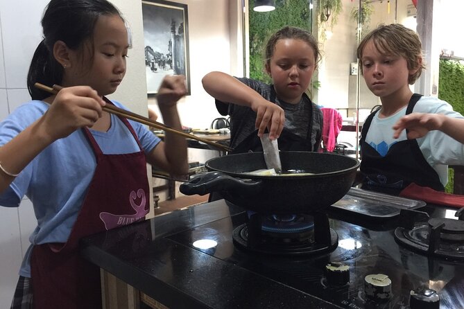Hanoi Cooking Class and Market Tour in Ancient House - Four Vietnamese dishes, with real work at the counter