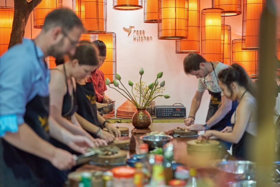 Hanoi: Cooking Class in a Local Villa with Market Tour - Cooking spring rolls, bun cha, and local salads