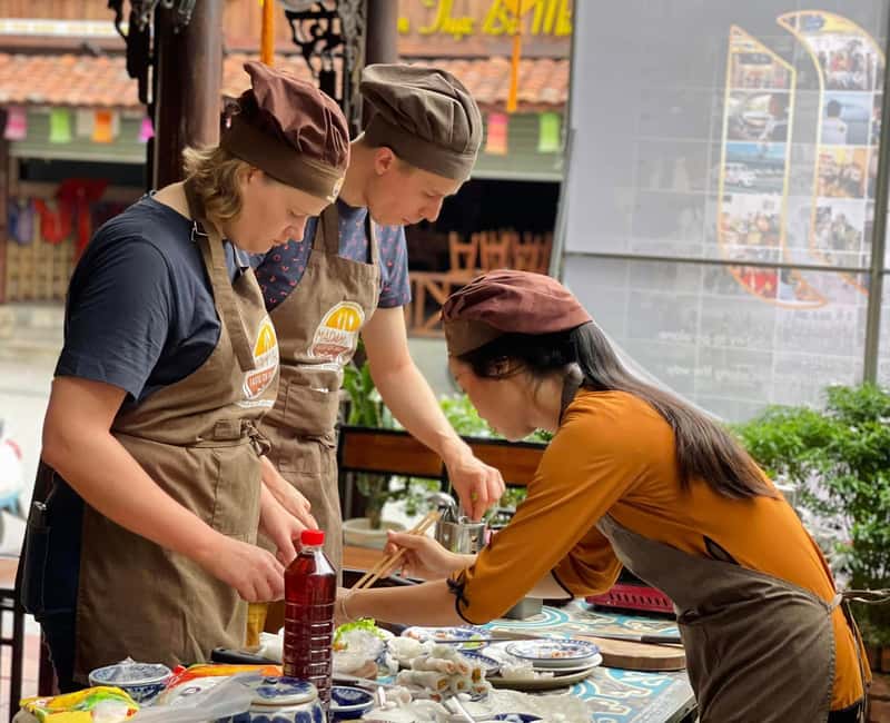 Hue City: Cyclo, Market Tour & Cooking Class at Madam Thu - Cooking bún bò Huế, bánh nậm, and nem rán