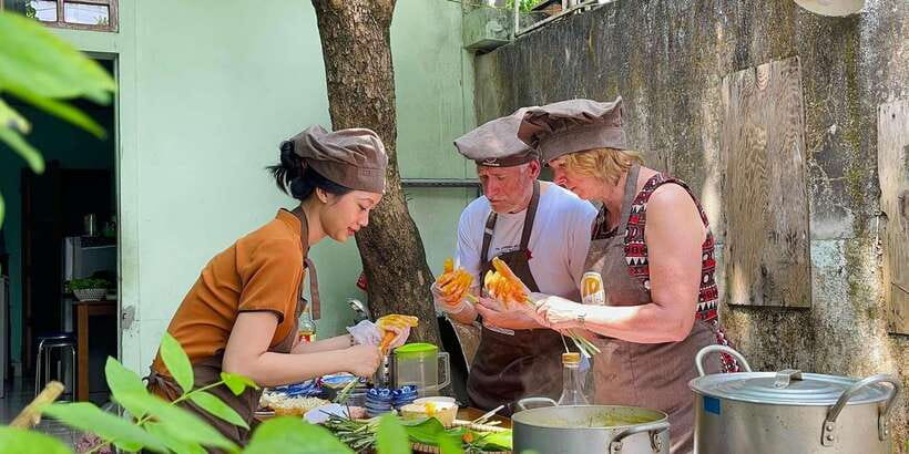 Hue Cooking Class : Best Local Restaurants with Madam Thu - Choosing ingredients at the local market