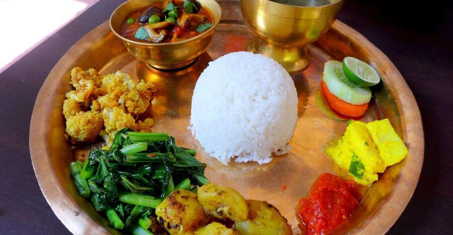 Kathmandu: Nepali Cooking Class with Hotel Pickup - Momo, curry, roti, and sel roti on the same table