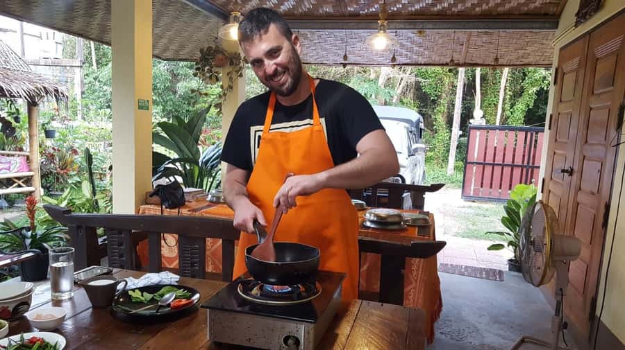 Koh Samui: Thai Cooking Class with Local Market Tour - Learning Thai flavor in a small kitchen