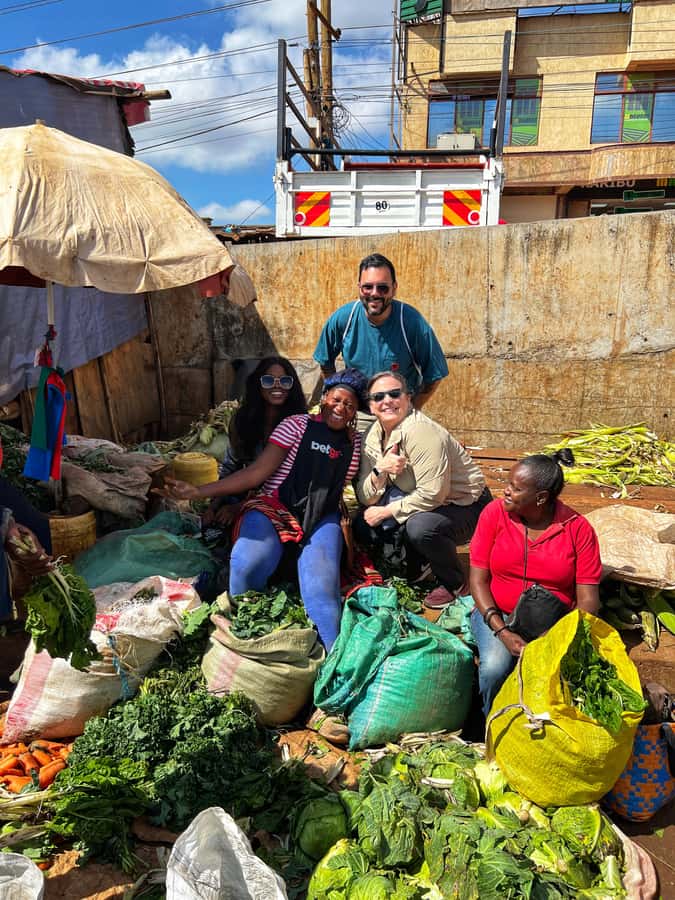 Local Market Tour and Traditional Meal Cooking Class - Shopping for ingredients in an African fresh market
