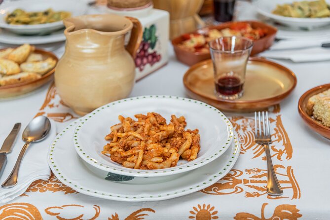 Lucca Walking Tour & Traditional Cooking Class with Wine - From Piazza dell’Anfiteatro to the food shop