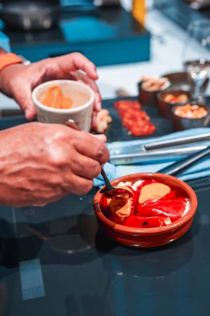 Madrid: Tapas Cooking Class with bottomless Wine Pairing - Starting with cava, cheese, and charcuterie