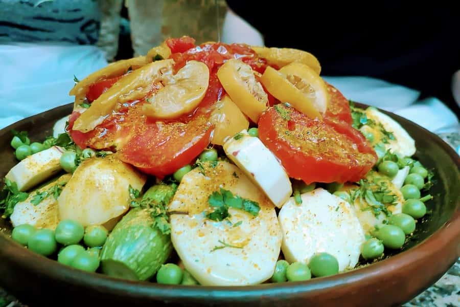 Marrakesh: Private Cooking Class & Local Market Shopping - Cooking tajine with a local host