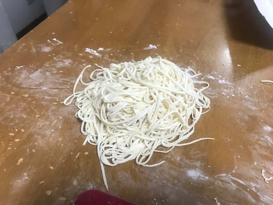 Osaka: Ramen and Gyoza Cooking Class in Dotonbori - Folding chicken gyoza while the dough rests