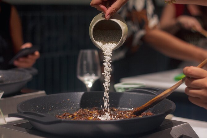 Paella Cooking Class in Madrid with Bottomless Wine Pairing - The communal table is part of the meal