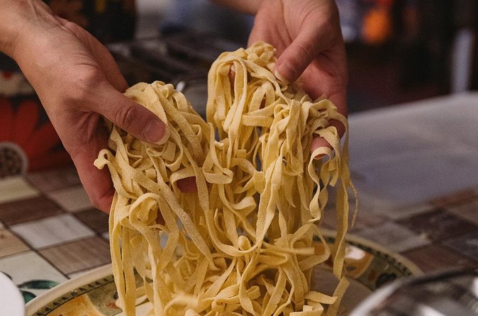 Palermo: Pasta and Tiramisu Small Group Cooking Class with Wine - Sitting down to eat what you made