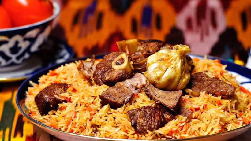 Plov and Samsa Cooking Class in Tashkent - Frying and steaming the plov