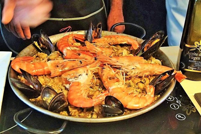 Premium Paella Cooking Class & 10 Spanish Tapas - Cooking a Spanish omelette together