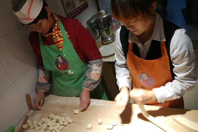 Private Hutong Culture Tour with Dumpling Cooking Class plus Cricket Fighting Game - Making dumplings in a local family’s home