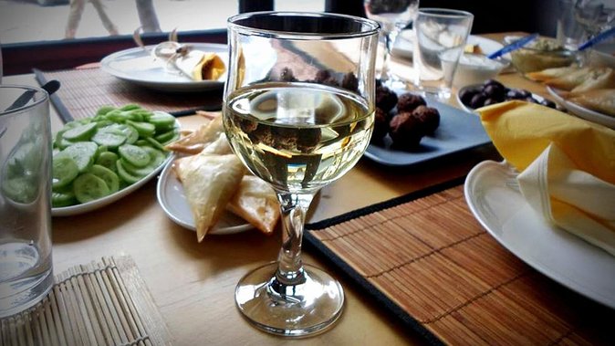 Private Walking Meze Cooking Course - Sitting down to eat the food you made