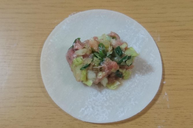 Ramen and Gyoza Cooking Class in Osaka - Folding two very different gyoza