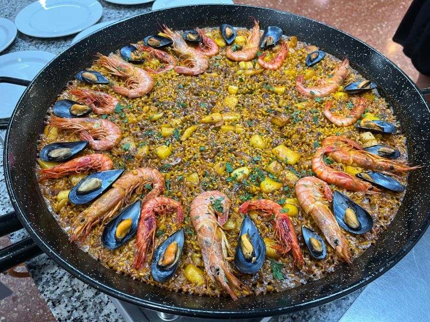 Real Paella Cooking Class – Market Visit & Sangría Workshop - Sitting down to a full Valencian meal