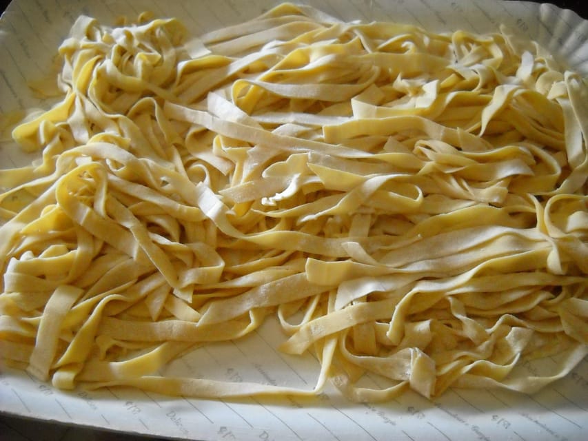 Rome: Homemade Tagliatelle Cooking Class + Prosecco & Lunch - Mixing the dough with flour, water, and egg