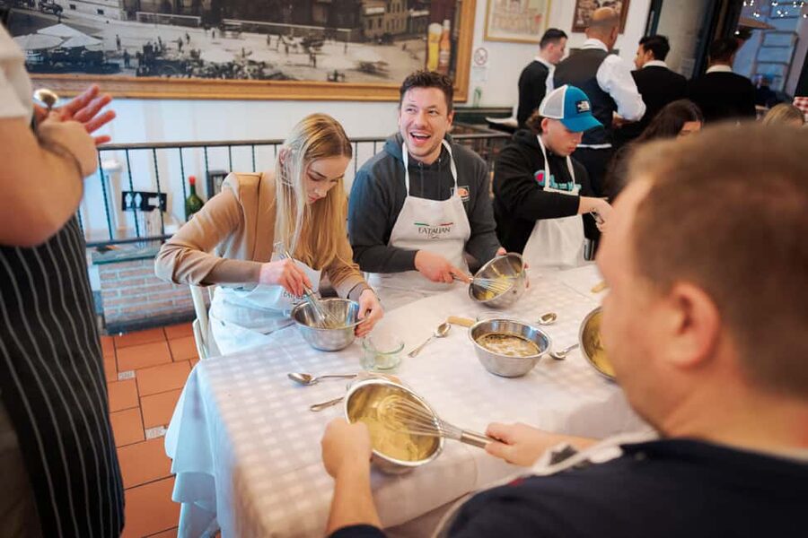 Rome: Pizza and Tiramisu Cooking Class in Piazza Navona - Sitting down to eat what you made