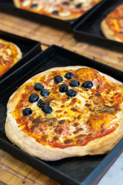 Rome: Pizza & Tiramisu Cooking Class with Meal and Drink - Sitting down to eat what you made