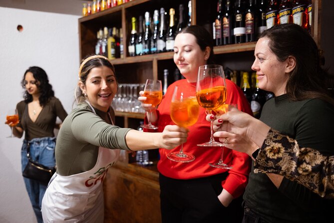 Rome Tipsy Cooking Class: Make Pasta and Mix 3 Spritz Cocktails - The first pour: mixing an Aperol Spritz