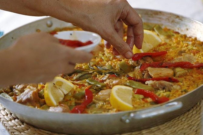Rooftop Paella Seafood Cooking Class Experience in Barcelona - Watching Alfonso build the seafood paella