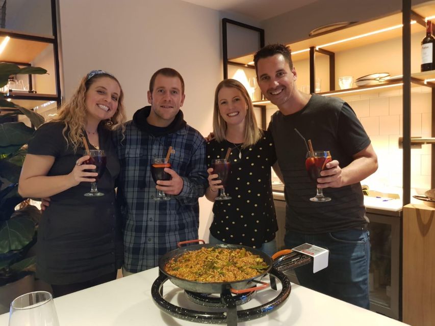 Seville: Paella-Cooking Experience with Sangria & Full Meal - Watching paella take shape in Seville