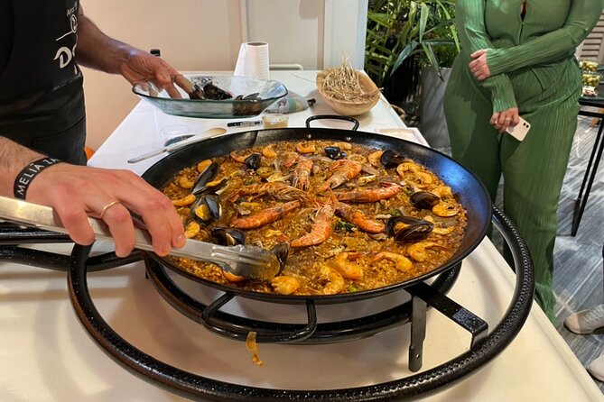 Seville: Paella Showcooking Experience - Starting with olives, cheese, and Iberian chacina
