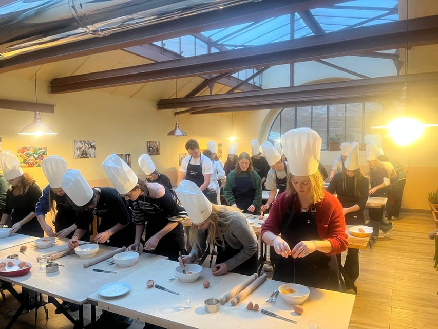 Siena: Pasta and Tiramisu Cooking Class with Wine - Making pasta in a Siena restaurant