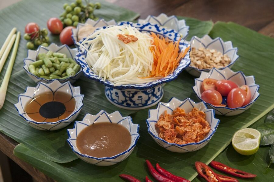 Sukhumvit: Hands-on Thai Cooking Class & Market Tour in BKK - The instructors make the class work