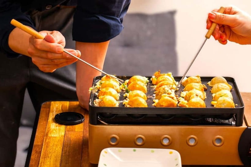Takoyaki cooking experience in Kabukicho, Shinjuku - A small group makes the turning stage easier