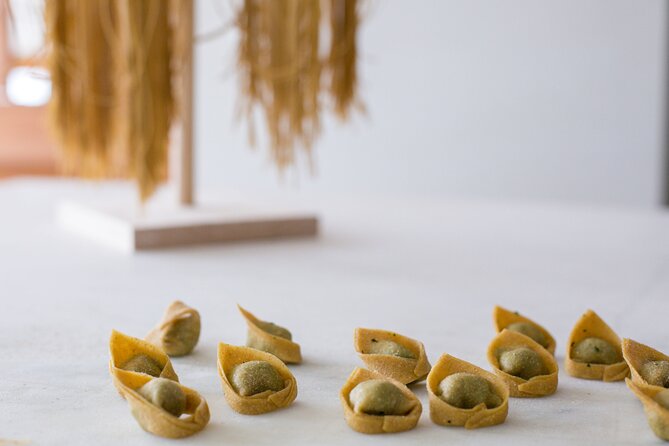 Tortelloni and Tagliatelle Cooking Class in Bologna + Wine - Making tortelloni with tomato and basil