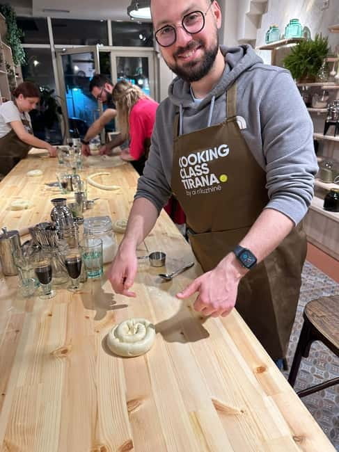 Traditional Albanian Cooking Class in Tirana & Raki Tasting - Rolling burek dough and learning the small details