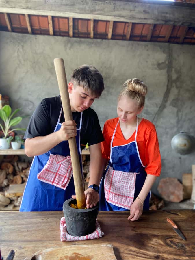 Ubud: Authentic Traditional Balinese Village Cooking Class - A garden lesson before the cooking begins