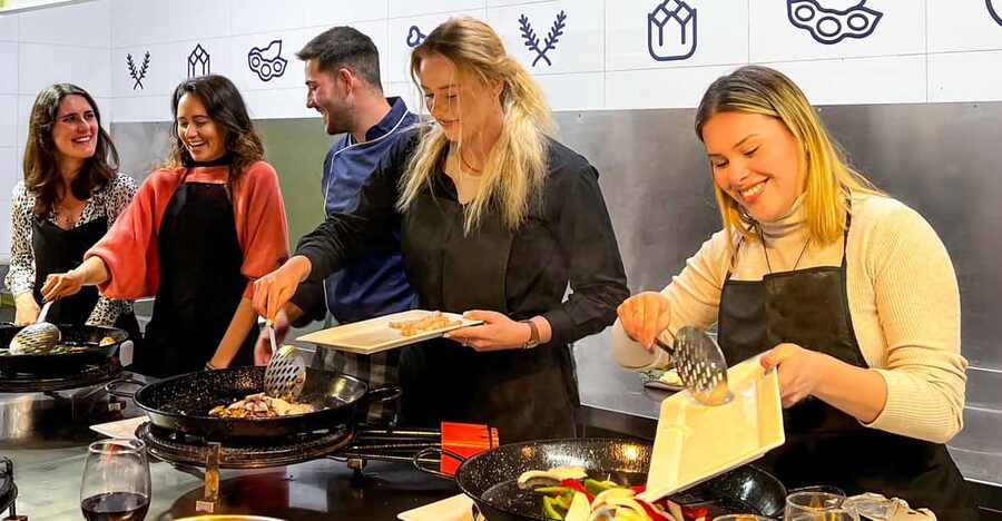 Valencia: Paella Cooking Class with Central Market Tour - Cooking your own paella, one step at a time