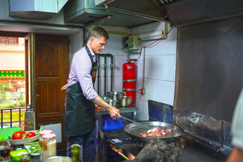Valencia: Traditional Paella Cooking Class and Dinner - Preparing the seafood paella